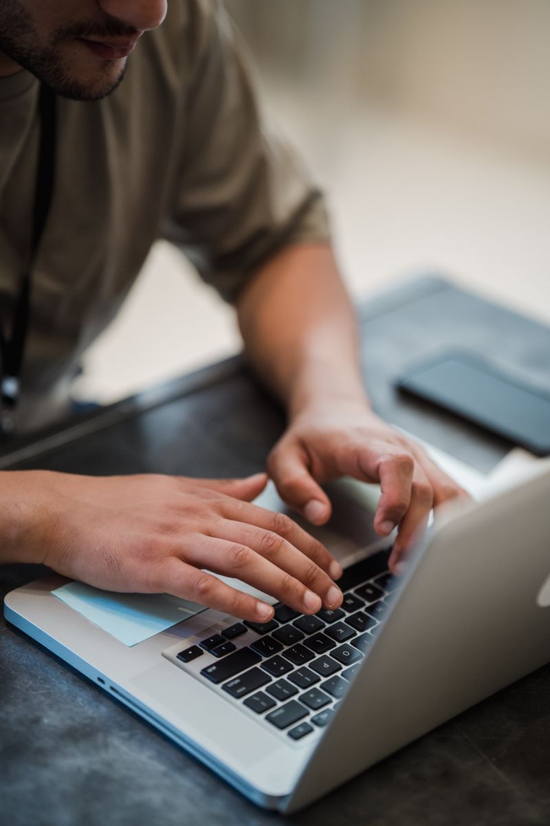 Person setting up audio device drivers on a Windows laptop Person setting up audio device drivers on a Windows laptop