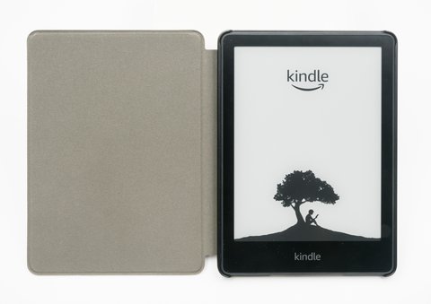 Amazon Kindle e-reader with cover open showing home screen Amazon Kindle e-reader with cover open showing home screen