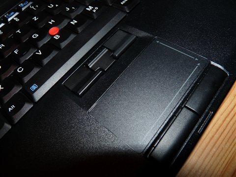 Close up of ThinkPad UltraNav touchpad and scroll buttons below the keyboard Close up of ThinkPad UltraNav touchpad and scroll buttons below the keyboard