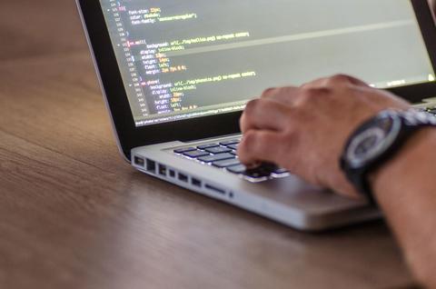 laptop being used to manually update a printer driver through Device Manager