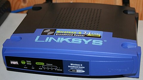 blue and black Linksys wireless router used for a home Wi-Fi network setup blue and black Linksys wireless router used for a home Wi-Fi network setup