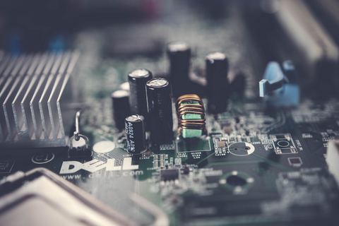 Close up of motherboard capacitors and heatsink near CPU socket
