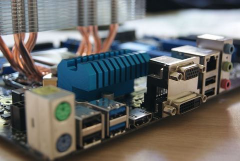 Motherboard rear IO panel showing color coded audio jacks