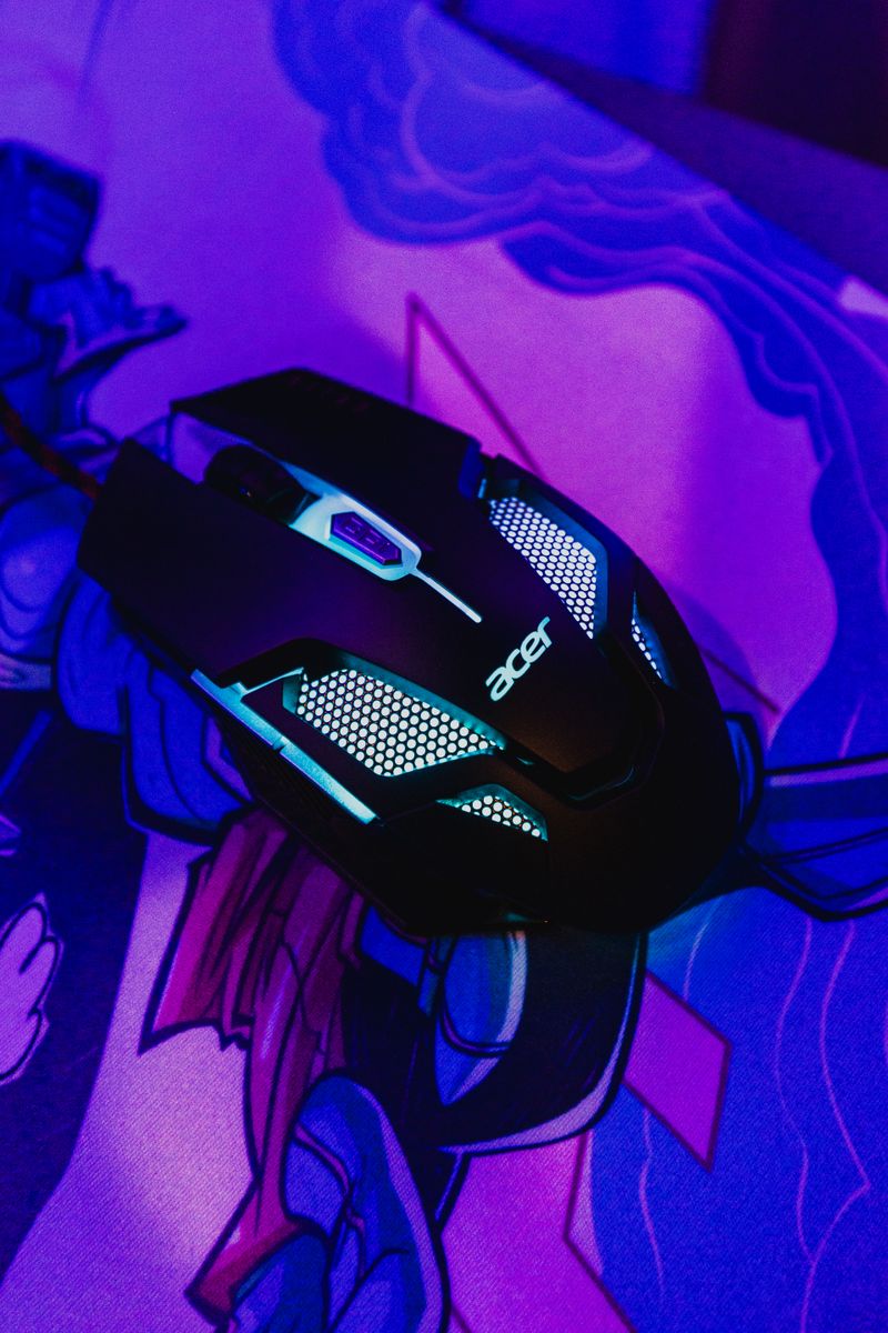 Close up of a wired RGB gaming mouse with side buttons Close up of a wired RGB gaming mouse with side buttons