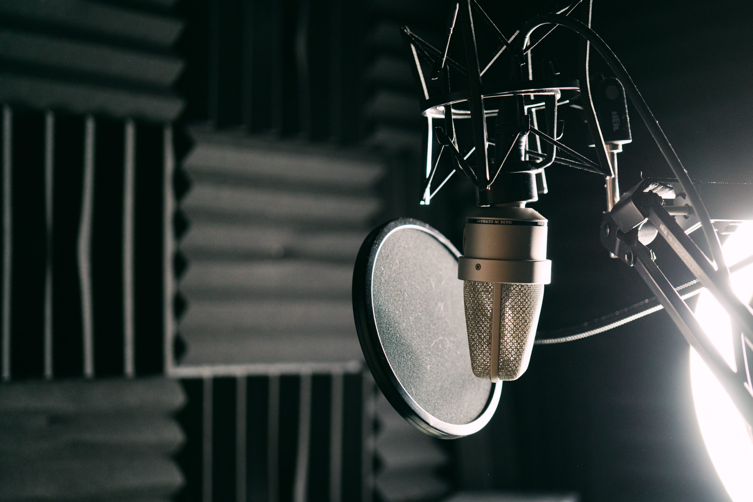 Close-up of a condenser microphone in a soundproofed setting