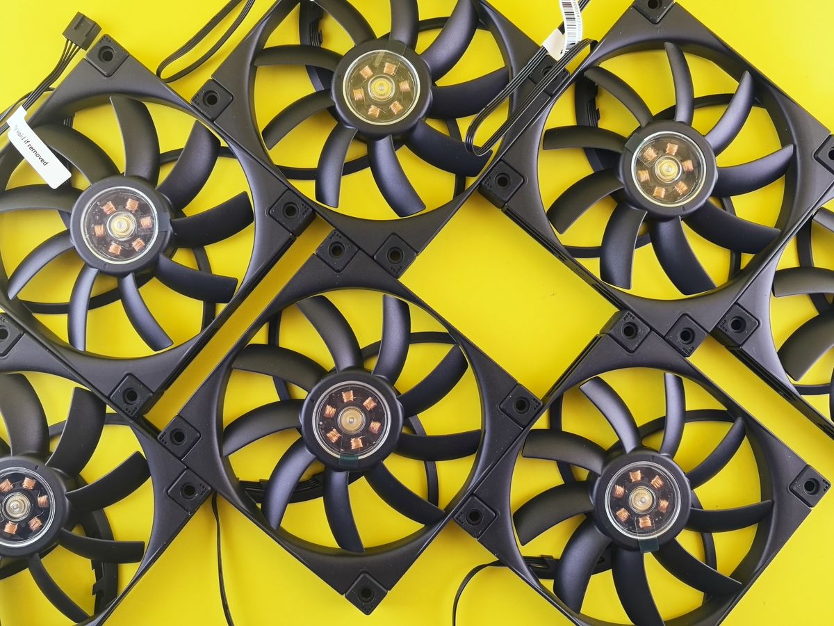 Multiple CPU cooling fans arranged on a bright background Multiple CPU cooling fans arranged on a bright background