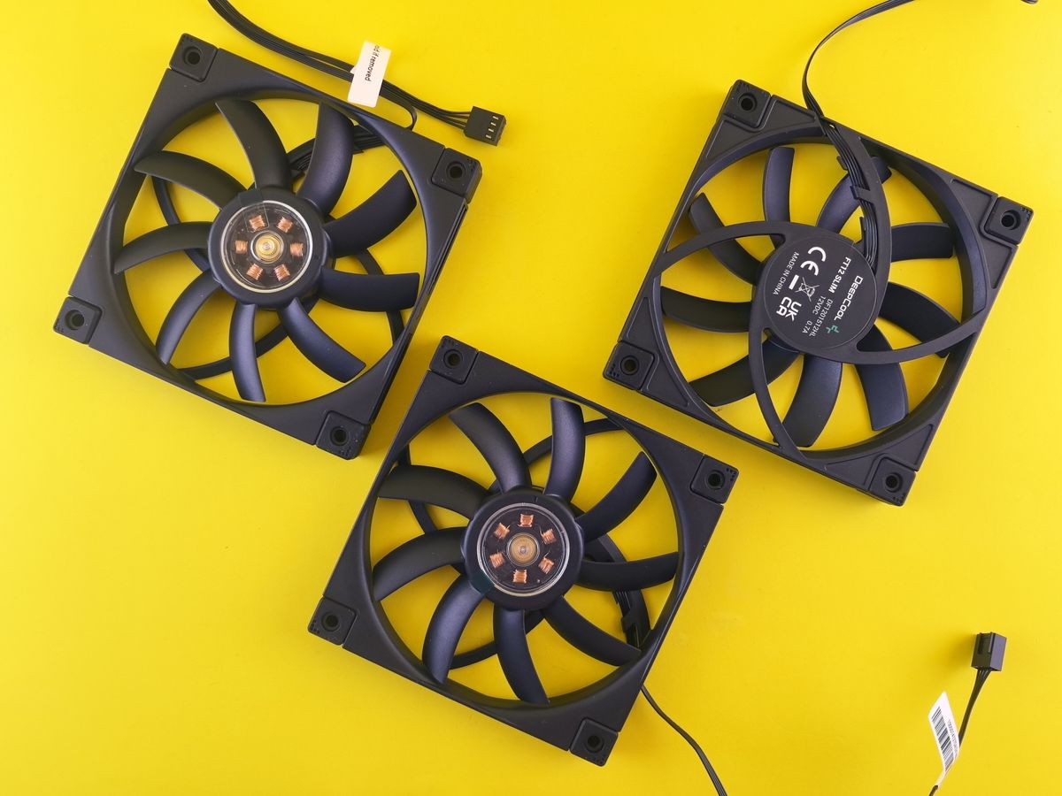 Three black computer cooling fans arranged for a dual tower CPU cooler build Three black computer cooling fans arranged for a dual tower CPU cooler build