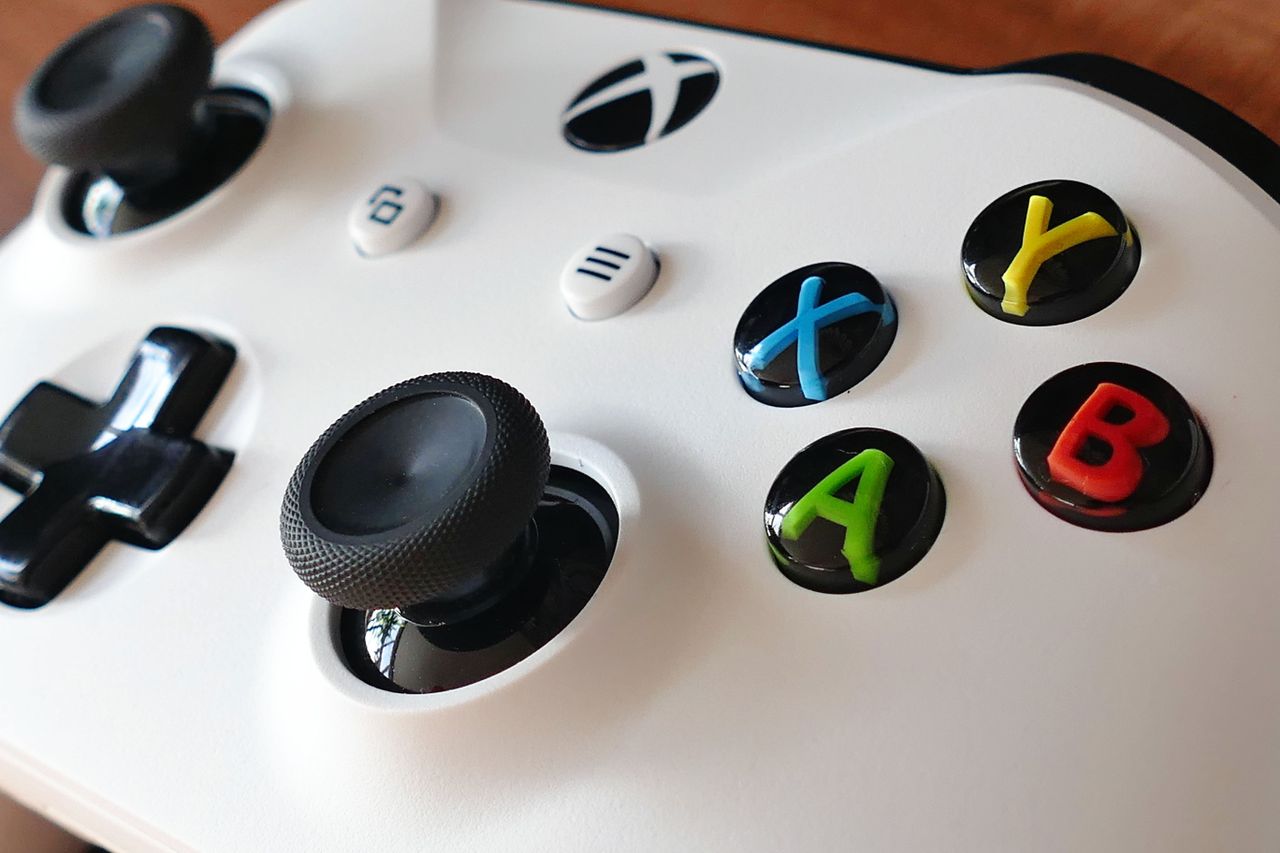 Close up shot of a white wireless game controller Close up shot of a white wireless game controller