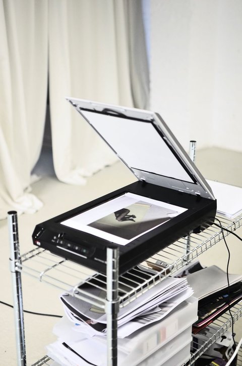 Flatbed scanner lid open with a photo placed on the glass ready to scan Flatbed scanner lid open with a photo placed on the glass ready to scan