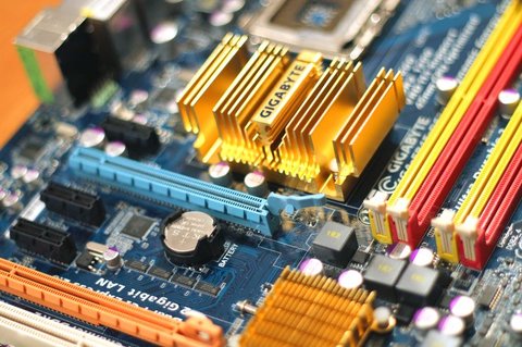 Close up of a PC motherboard with heatsink and expansion slots