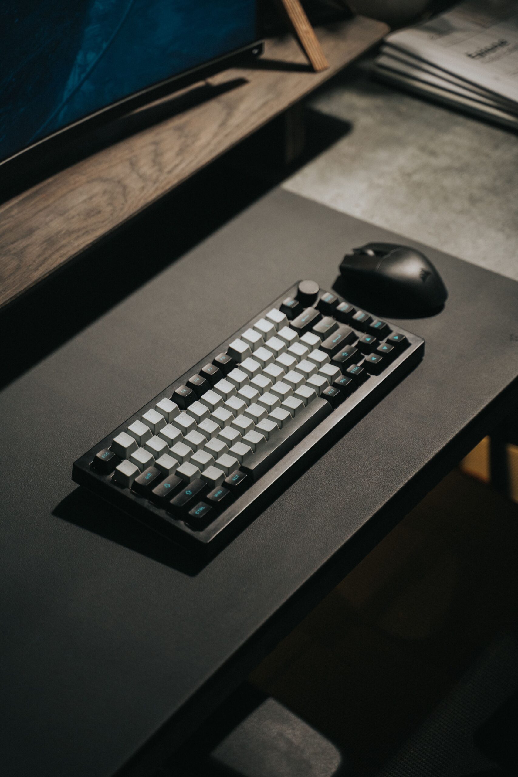 Wireless mouse and mechanical gaming keyboard on a desk Wireless mouse and mechanical gaming keyboard on a desk