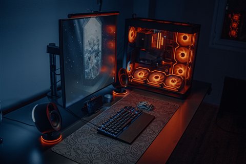 RGB gaming desk setup similar to an Apex 3 keyboard configuration
