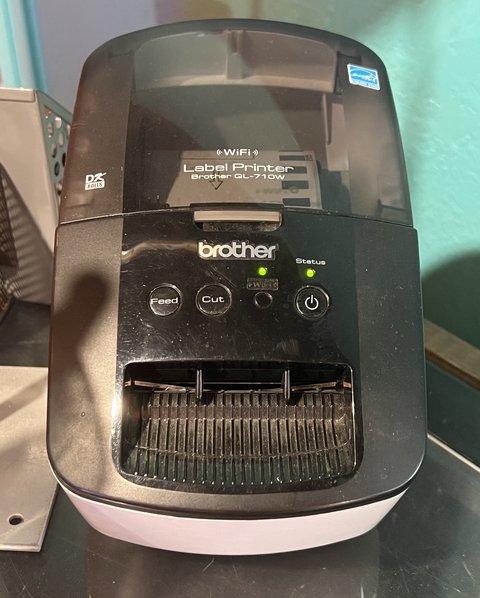 Brother QL series label printer on a desk with WiFi label Brother QL series label printer on a desk with WiFi label