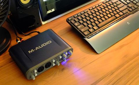 External USB audio interface connected to a desktop computer setup External USB audio interface connected to a desktop computer setup