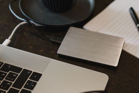 External hard drive sitting next to a laptop that fails to show it in File Explorer External hard drive sitting next to a laptop that fails to show it in File Explorer