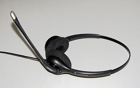 Plantronics headset with adjustable boom microphone on white background Plantronics headset with adjustable boom microphone on white background