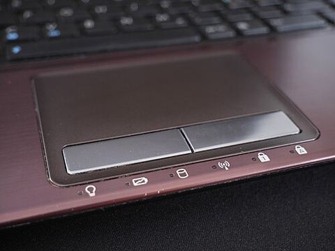 Close-up view of a laptop touchpad and palm rest area Close-up view of a laptop touchpad and palm rest area