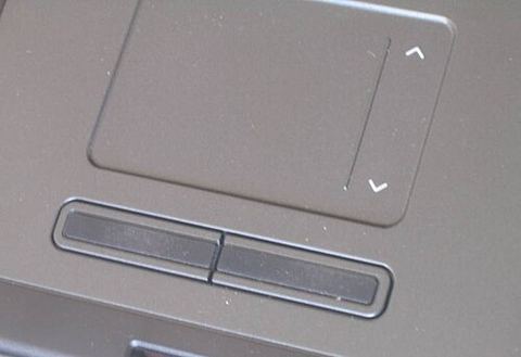 Laptop touchpad with scroll indicator arrows and click buttons below Laptop touchpad with scroll indicator arrows and click buttons below