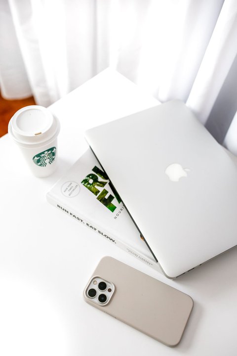 Minimalist desk workspace with laptop and coffee cup Minimalist desk workspace with laptop and coffee cup