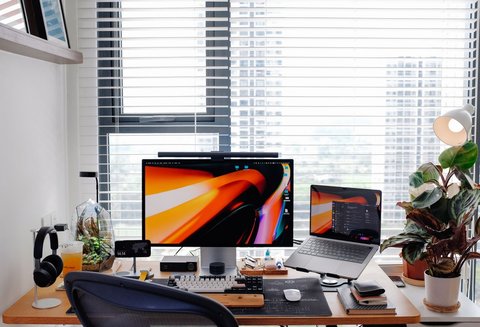 Modern desk workspace with laptop and monitor setup Modern desk workspace with laptop and monitor setup