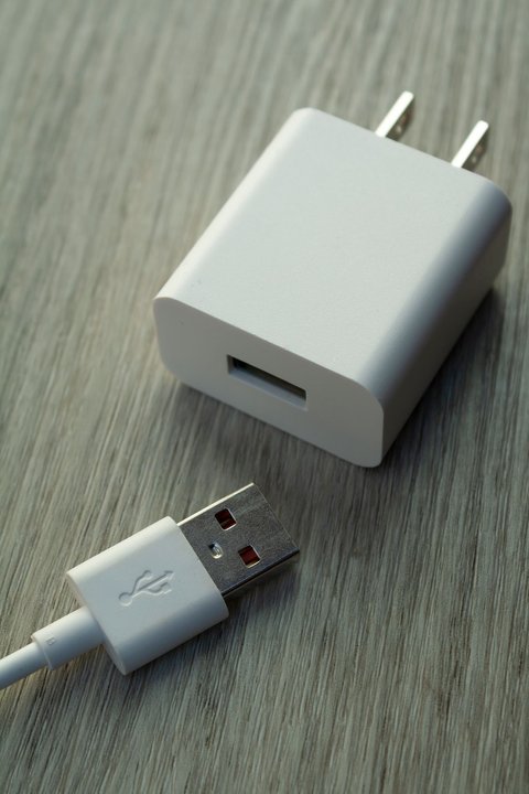 Close up of a white USB charging cable and adapter Close up of a white USB charging cable and adapter