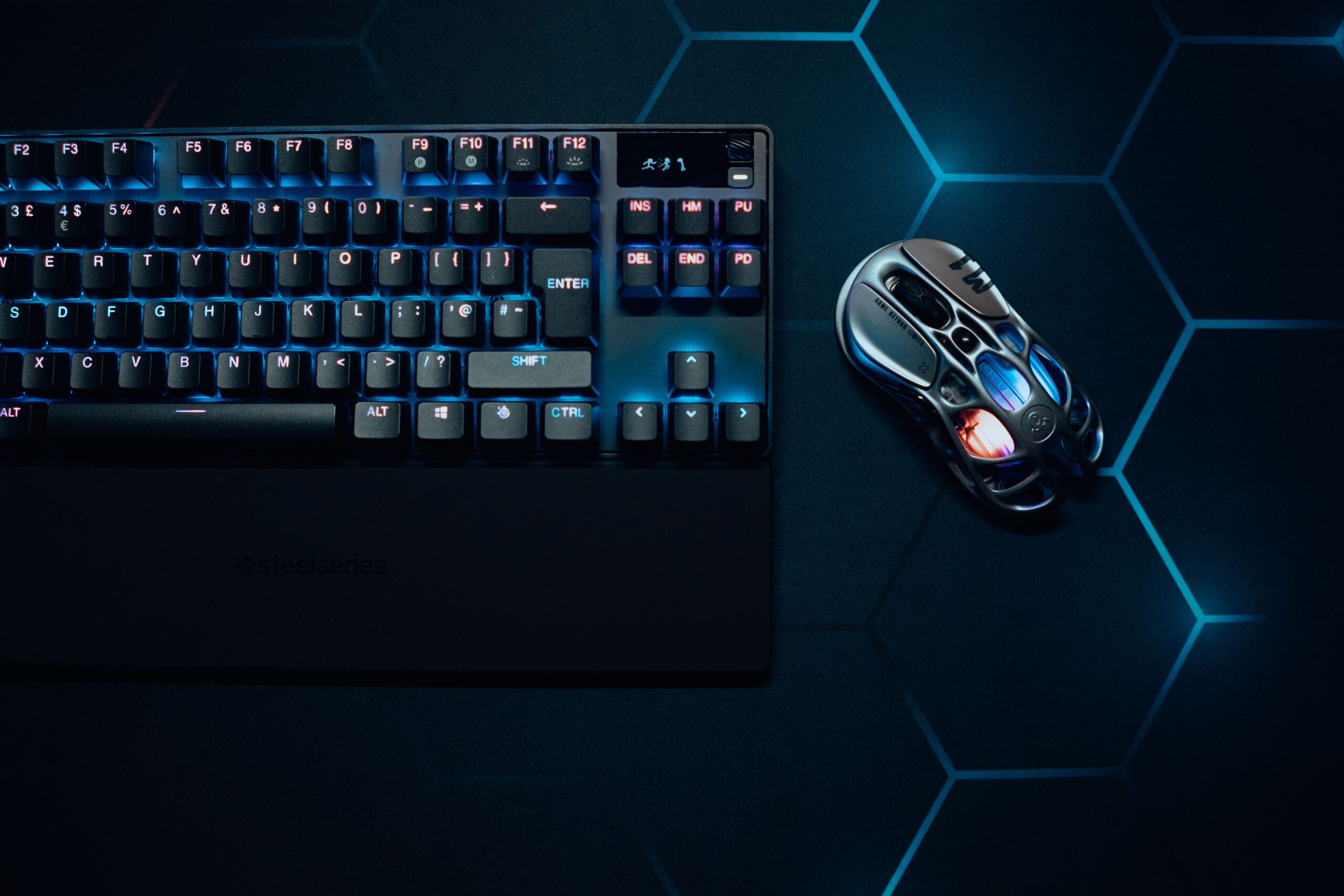 RGB gaming keyboard and mouse setup on a desk RGB gaming keyboard and mouse setup on a desk