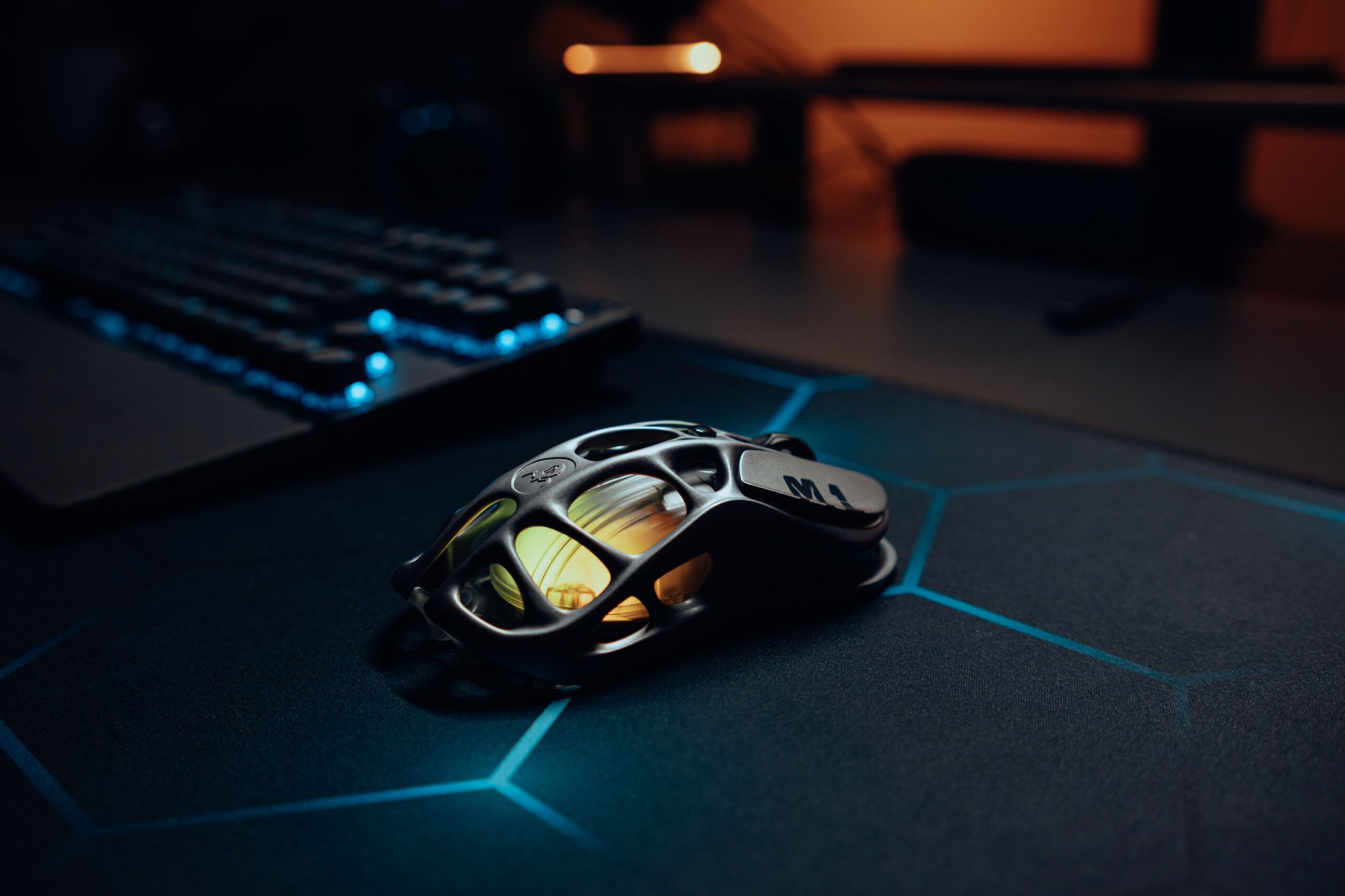 Close up view of a gaming mouse with RGB lighting on a mouse pad Close up view of a gaming mouse with RGB lighting on a mouse pad