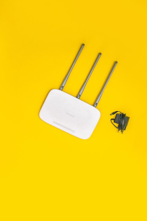 Home wireless router with three antennas used for WiFi network