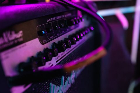 Guitar amplifier cable connection and effects control section close up Guitar amplifier cable connection and effects control section close up
