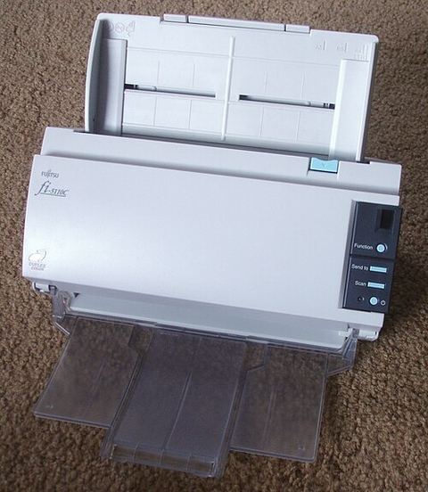 Fujitsu ScanSnap portable document scanner with paper tray open Fujitsu ScanSnap portable document scanner with paper tray open