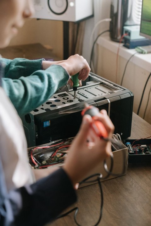 hands typing on a laptop keyboard while installing new printer software hands typing on a laptop keyboard while installing new printer software