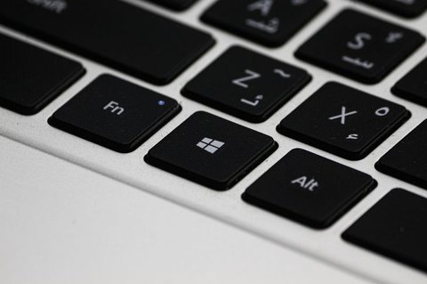 close up of the windows key on a laptop keyboard for driver settings close up of the windows key on a laptop keyboard for driver settings