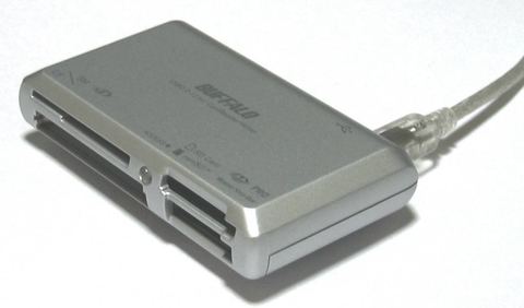 Multiple memory card reader and writer device on a desk