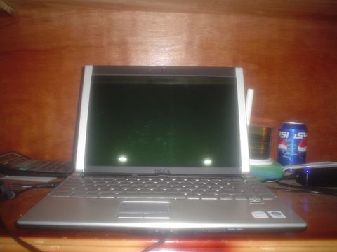 Laptop with a Validity style fingerprint reader below the keyboard