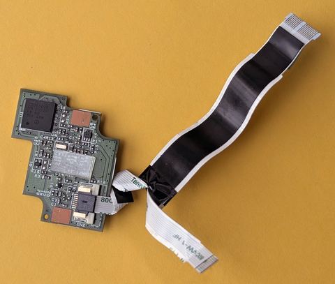 Internal view of a laptop fingerprint sensor module and its ribbon cable Internal view of a laptop fingerprint sensor module and its ribbon cable