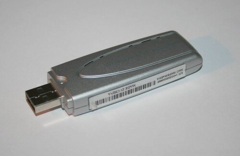 small silver USB wireless network dongle similar to the WUSB54G adapter small silver USB wireless network dongle similar to the WUSB54G adapter