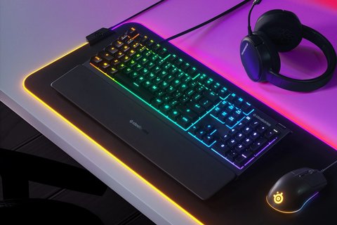SteelSeries Apex 3 gaming keyboard with RGB lighting on desk setup