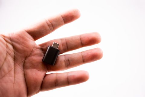 Tiny nano USB Bluetooth adapter resting on a palm Tiny nano USB Bluetooth adapter resting on a palm