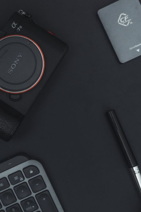 Card reader placed next to a digital camera and keyboard