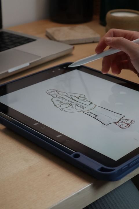 digital sketch being drawn with a stylus pen on tablet screen