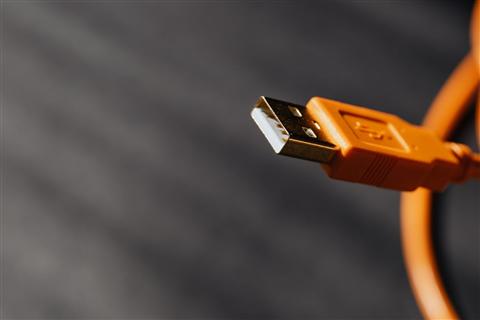 Close up of a USB cable connector used to link a Lexmark printer to a laptop Close up of a USB cable connector used to link a Lexmark printer to a laptop