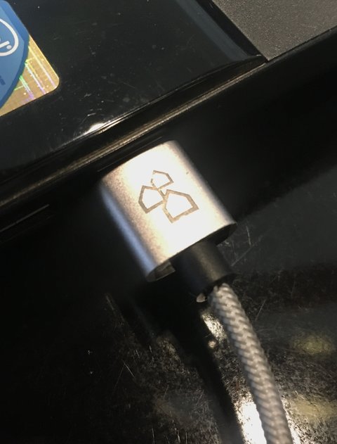 USB cable plugged into a laptop USB port USB cable plugged into a laptop USB port