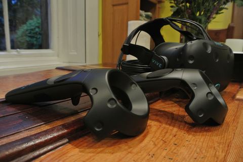 HTC Vive headset shown together with its motion controllers HTC Vive headset shown together with its motion controllers