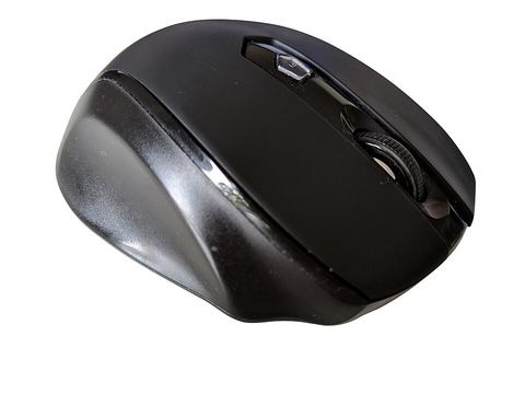 wireless computer mouse with USB receiver dongle nearby wireless computer mouse with USB receiver dongle nearby