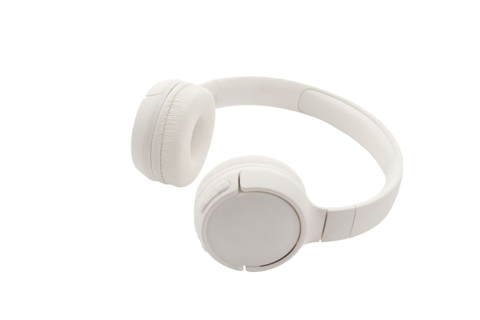 White wireless headphones on a white backdrop White wireless headphones on a white backdrop