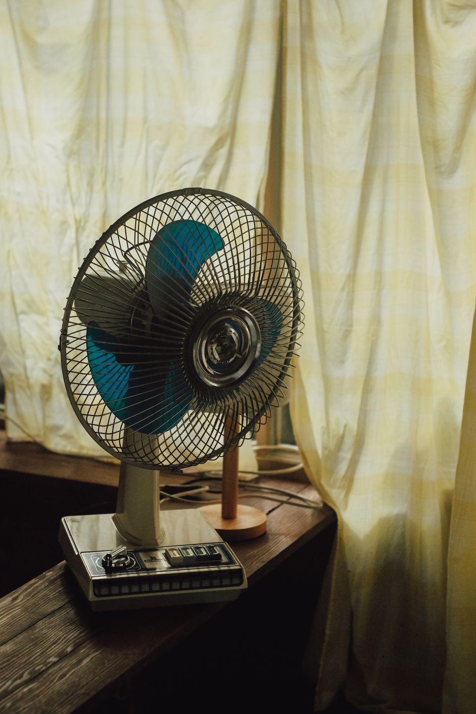 Small electric fan near a sunlit window Small electric fan near a sunlit window