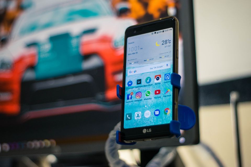 Smartphone secured in a car mount holder Smartphone secured in a car mount holder