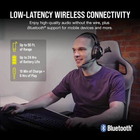 Person wearing the Corsair HS55 wireless headset while using a gaming PC desk setup Person wearing the Corsair HS55 wireless headset while using a gaming PC desk setup