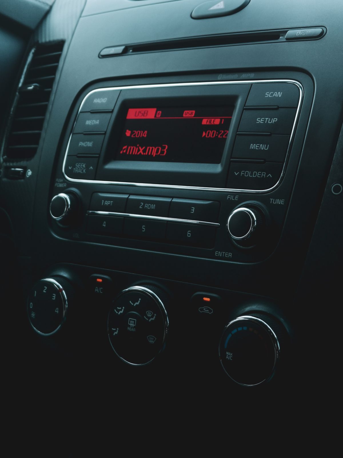 Close up of car stereo display showing USB media file playback screen Close up of car stereo display showing USB media file playback screen