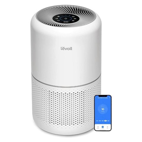 Levoit air purifier next to a smartphone displaying the VeSync connection app Levoit air purifier next to a smartphone displaying the VeSync connection app